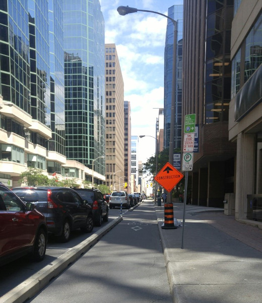 Protected bike lane with construction sign not blocking it