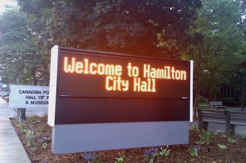 Welcome to City Hall, sign in front of 71 Main St. W.