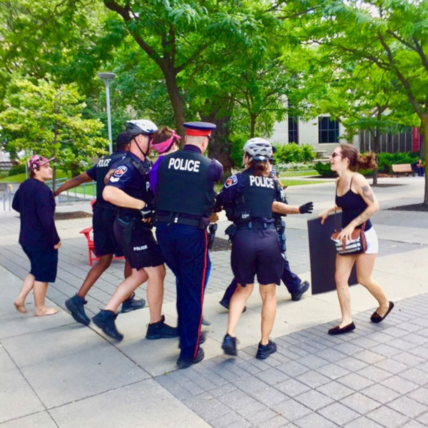 Hamilton Police arresting Woody Boychuk at the August 10, 2019 rally against hate (Image Credit: Graham Crawford)