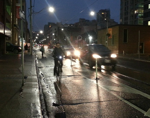 Person riding a bicycle on Adelaide Street, Toronto (RTH file photo)