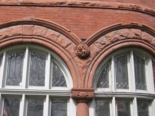 Figure 16. Detail of the window surround and carving on the Hendrie House, designed by W.A. Edwards in 1892. Brownstone and red brick.