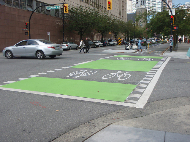 Intersection pavement markings on Dunsmuir Cycle Track, Vancouver (Image Credit: Alexander Pope/Flickr, CC-BY-NC-ND)