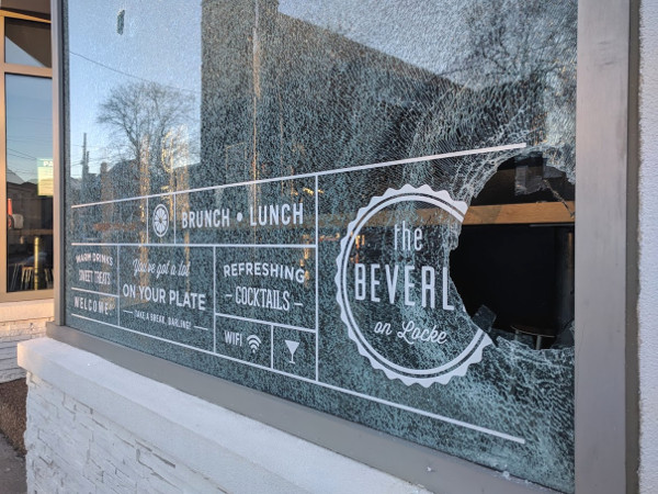 Smashed window at The Beverly
