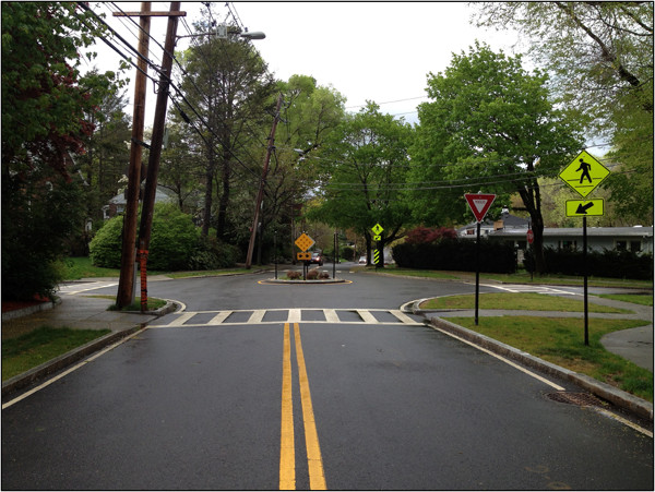 Mini-roundabout on a residential side street (Image Credit: NACTO)