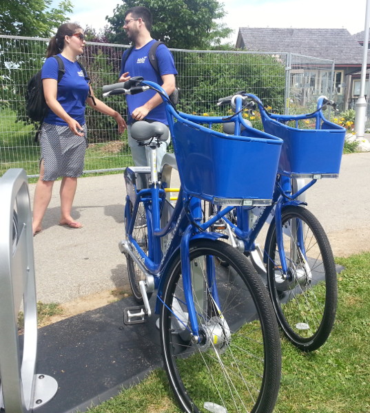 Chelsea Cox and Justin Wiley of Social Bicycles at the bike share station down by the waterfront