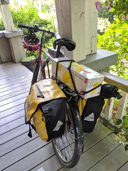 Case of soda strapped to bike rack