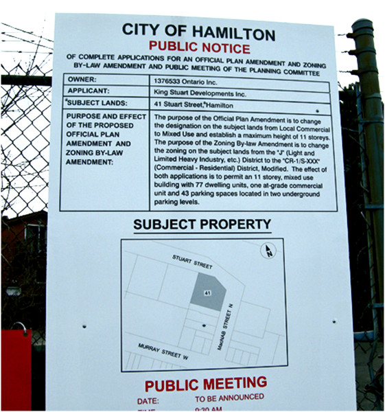 Notice of application for an Official Plan Amendment at the corner of MacNab and Stuart, kitty-corner from the entrance to the West Harbour GO station.