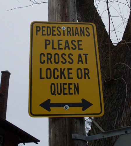 PEDESTRIANS PLEASE CROSS AT LOCKE OR QUEEN