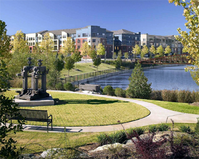 Old steel presses have been preserved as outdoor sculptures in the Commons Park overlooking the lake and new townhouses.