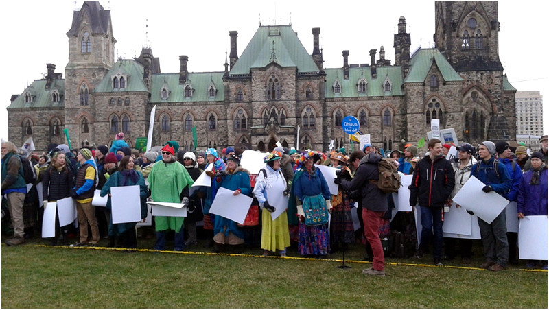 Raging Grannies getting ready to make the human sign.