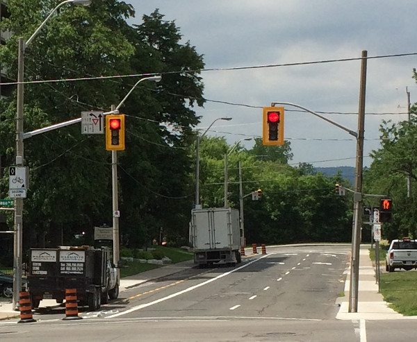 Trucks parked in Hunter Street bike lanes (Image Credit: Bob Berberick)