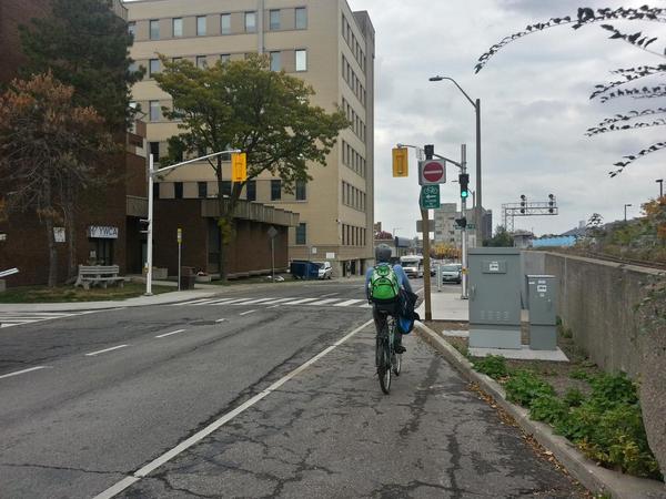 Bike Lane Ends sign blocks visibility of traffic signal