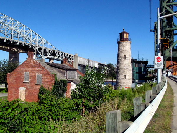 The lighthouse and cottage are scrunched between the Skyway and Lift Bridge on the Hamilton side of the Beach Canal