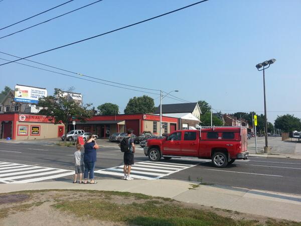 Family trying to cross Cannon Street at Elgin