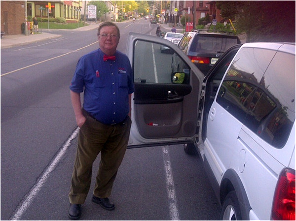 Car parked on the west curb on Dundurn Street South with door opening into southbound bike lane