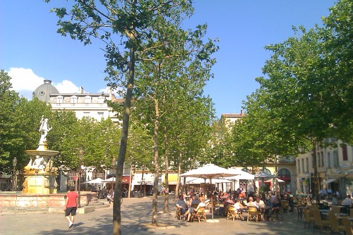 People relax in Place Carnot
