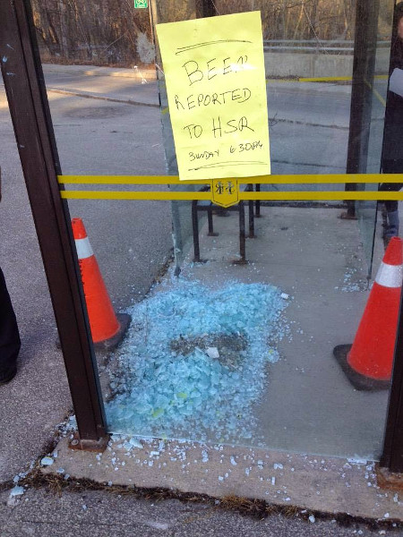 Bus shelter with broken window