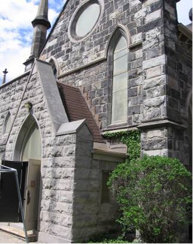 Figure 8: Church of the Ascension. Note the contrast between the grey stone of the entrance (added later and made of Eramosa dolomite) and the blackened Whirlpool sandstone used to construct the original church in 1851.
