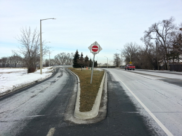 Another useless grass wedge at Claremont Access and West 5th