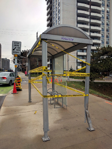 This bus shelter at Hunter and Bay was struck by a person driving a car, not a person riding a bike