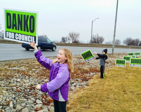 Holding campaign signs