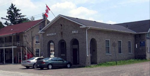Figure 3: Beverley Hall. The building behind is The Rockton Grocery and Post Office, originally the Rockton Hotel. It is built of larger, better trimmed blocks than the Hall, and has an iron verandah, so was probably built somewhat later. The stone is Guelph dolomite from North Beverly.