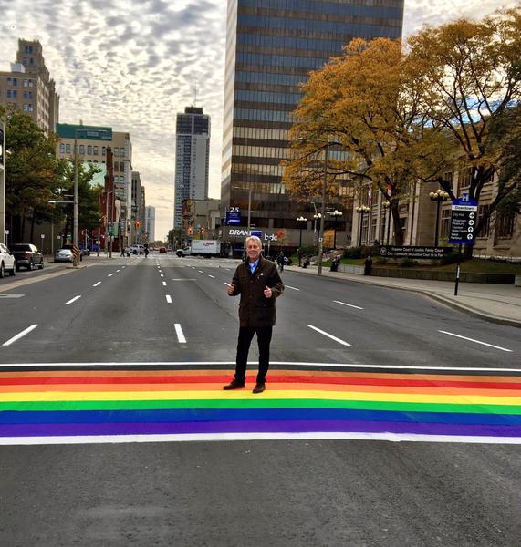 Mayor Fred Eisenberger poses on the rainbow crosswalk (Image Credit: Fred Eisenberger)