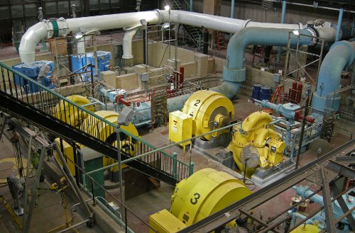 Three horizontal centrifugal pumps (yellow) with two new vertical centrifugal pumps (blue) being prepared to join them.