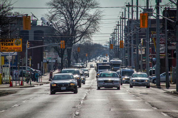 The green wave of timed traffic moves at 50-60 km/hr, four lanes wide