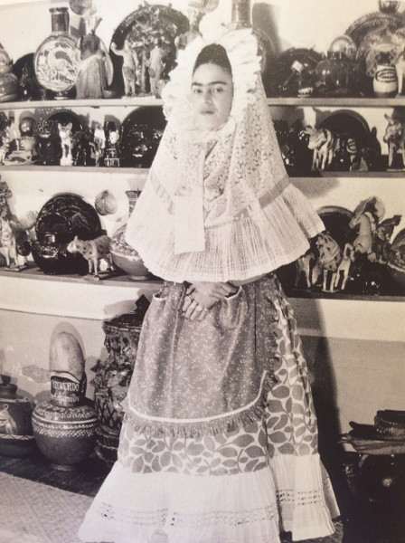 Frida, at home, in the Blue House, dressed in traditional Tehuana garb, circa 1940.