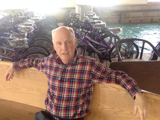 Raconteur, local historian and today's Chairman of Valley City (sitting on one of the last Valley City church pews on site)