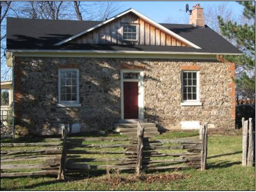 Figure 4a. The James McFarland House, at 1436 Concession 2, Niagara-on-the-Lake: built of local fieldstone in 1851 (photo by Bob Watson). Brick used for voussoirs and quoins.