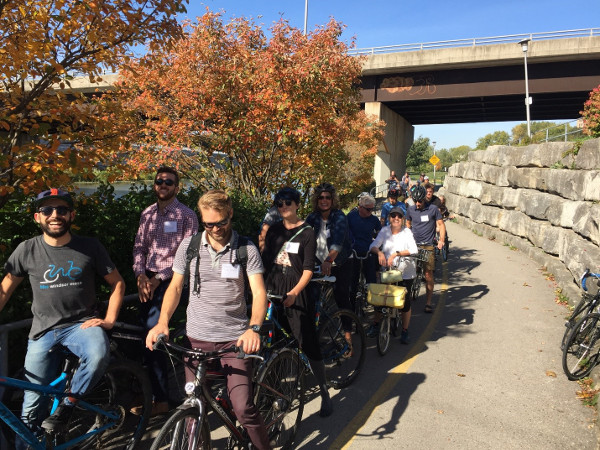 Summit participants riding through London