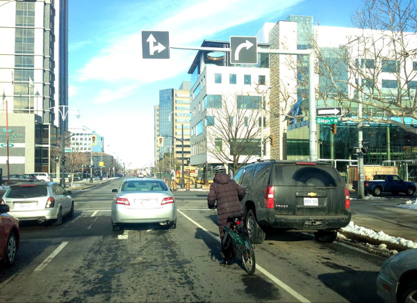 Cyclist on Bay crossing Main