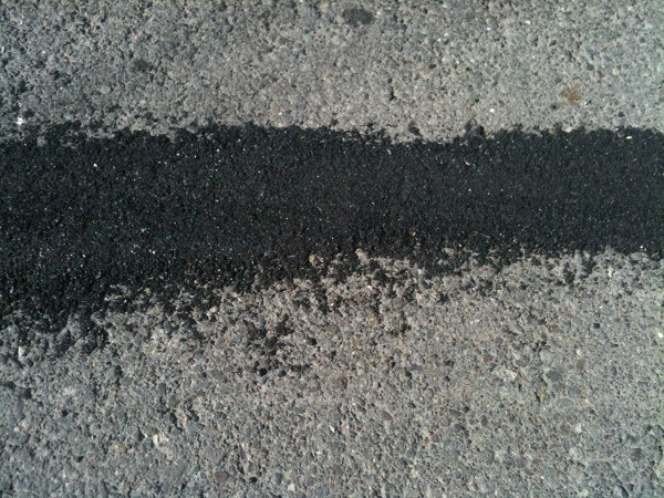Closeup of a fixed crack on Cannon Cycle Track