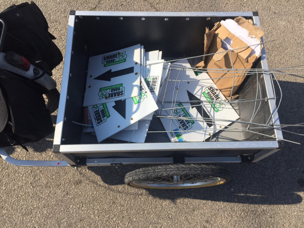 Kevin's bike trailer, loaded with route directional signs