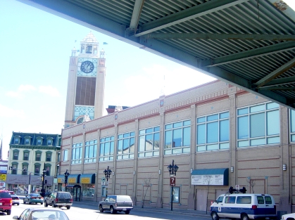 The old Eaton Centre offers only a blank wall to the outside world. Note the tacky, fake flags on the cartoony clock tower