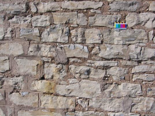 Figure 10.  Detail of the rubble stone in the front part of the Gatehouse. Note lighter coloured chert in brown dolomite. Scale in cms.