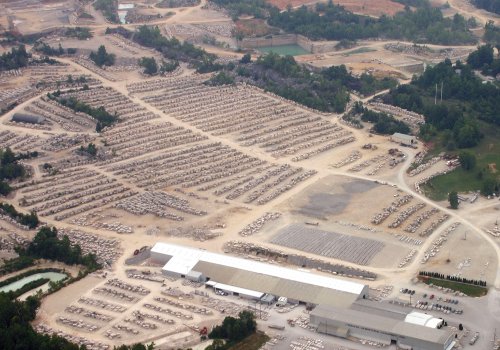 Figure 3. An aerial photograph of a modern quarry in the Indiana limestone (courtesy of the Indiana Limestone Company). The active quarry faces are behind the stone block 