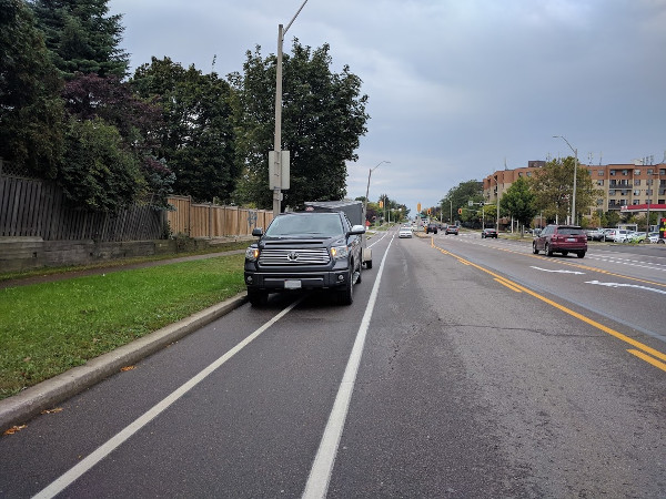 Because bike lane is not protected, drivers continue to use it for parking