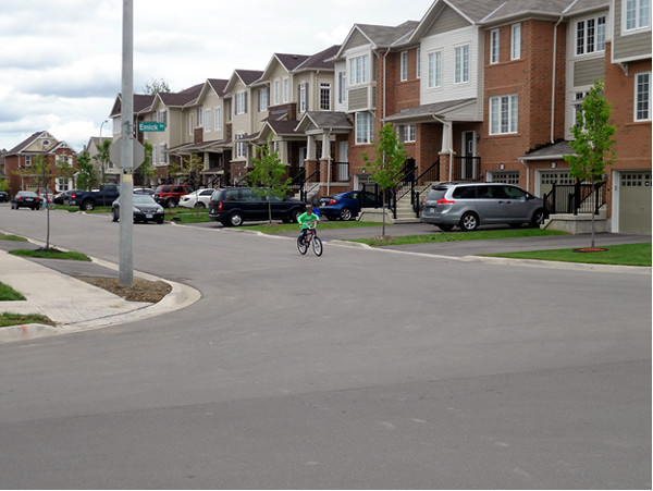 A row of townhouses in one of the newer surveys in the Meadowlands, adding density, income variation, and (here) a little street life to the neighbourhood