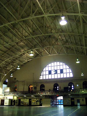 The enormous front-gabled wooden roof with steel lattice covers the largest room in the building - 100 years old and no leaks. This room is used for training and large gatherings. In a time of crisis this room could be used to temporarily house many people with cots. 