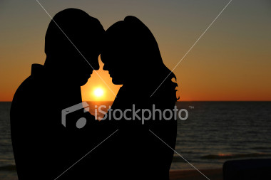The silhouetted couple on the beach: always in stock