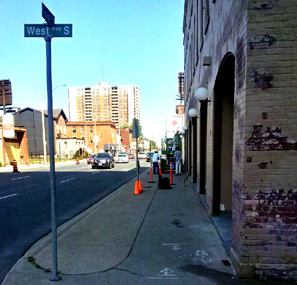 Sidewalk blocked for window-washers at West Avenue and King