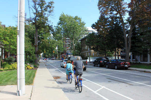 Couple riding Hamilton Bike Share bikes on Herkimer