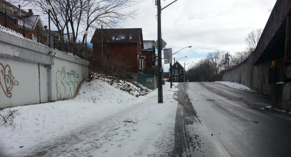 Snow-covered bike lane and sidewalk on Young Street west of Wellington (Image Credit: Ryan McGreal)