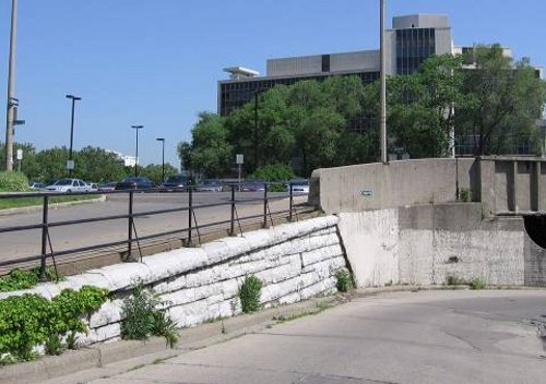 Figure 4. TH&B tunnel embankment (at Park St), built of white Kingston stone in 1895.