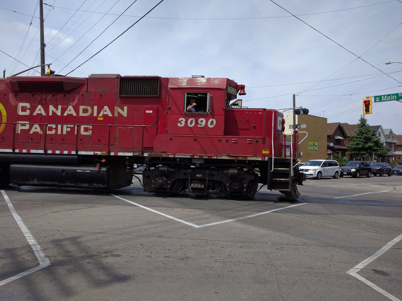 Train engine crossing diagonally through Main and Gage intersection