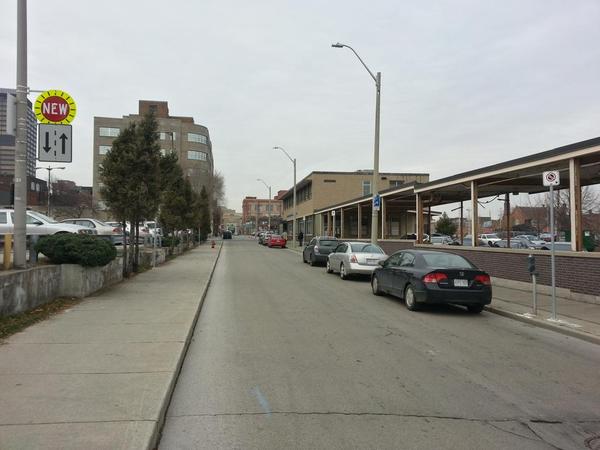 Rebecca Street between Catharine and John: two-way traffic, curbside parking, sky remains firmly in place
