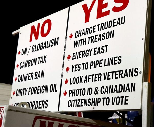 Prominent sign in the 'United We Roll' Yellow Vest convoy